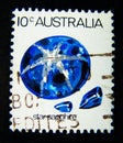 A stamp printed in Australia shows an image of blue star sapphire stone on value at 10 cent. Royalty Free Stock Photo